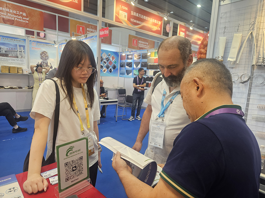 Presenting product catalogue to buyers at the 140th Canton Fair